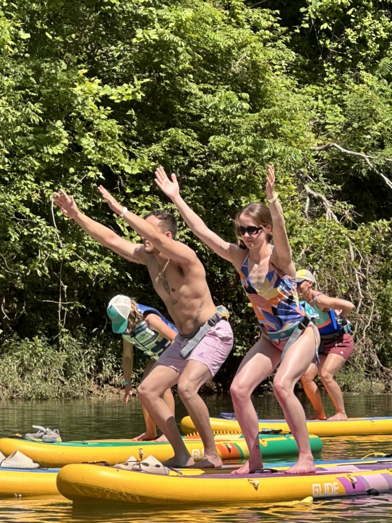 Paddleboard yoga is fun for friends or couples!